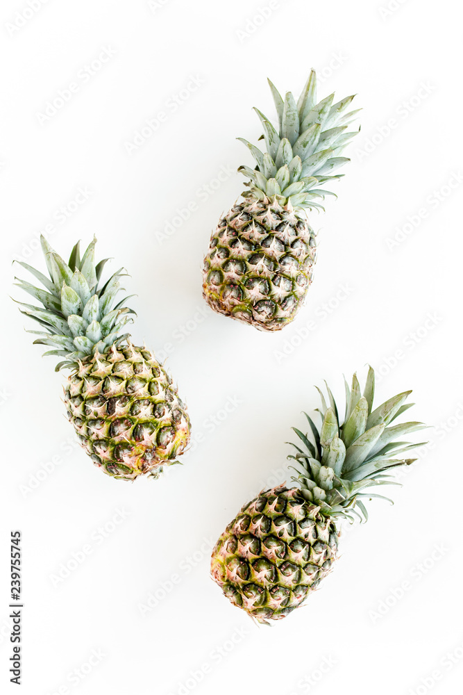 Pineapples isolated on white background. Food concept. Flat lay, top view Pineapples isolated on white background. Food concept. Flat lay, top view