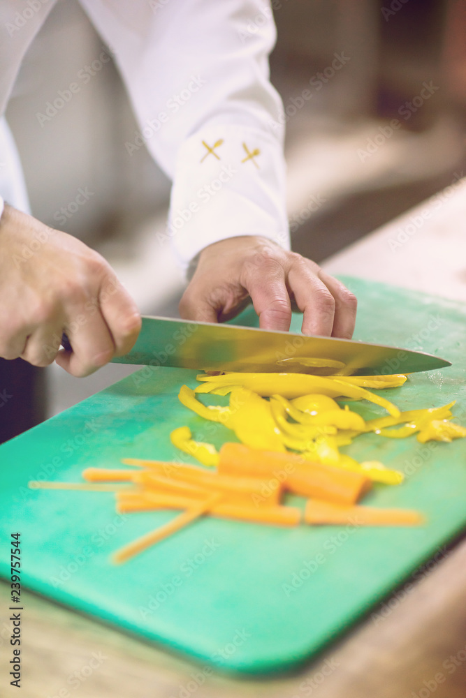 Chef hands cutting fresh and delicious vegetables