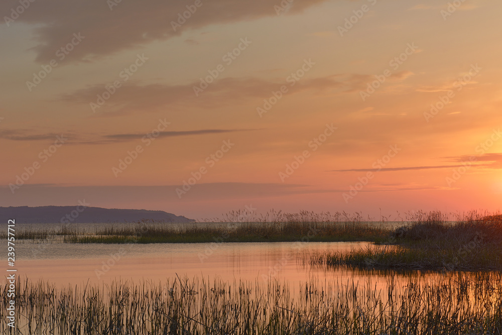 Sunset over the river in the spring Sunset over the river in the spring