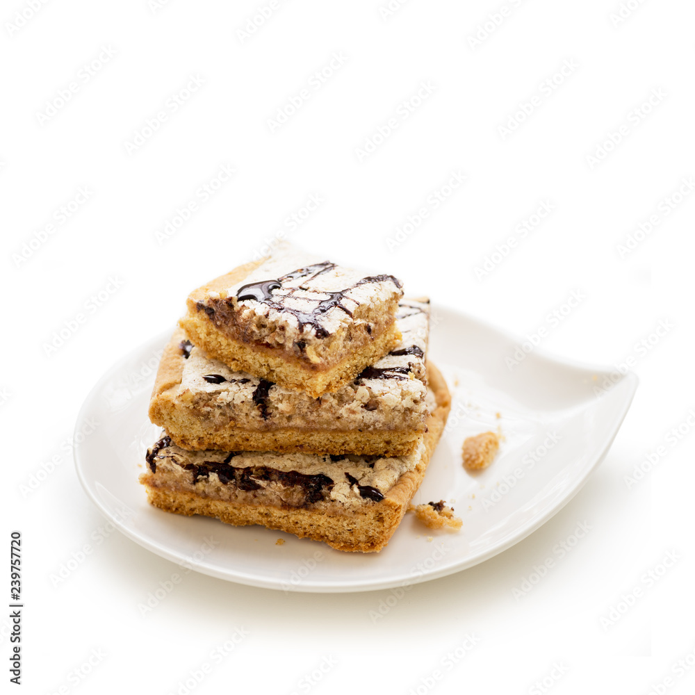 Mazurek, traditional polish tart baked for Easter. In some regions it is also prepared at Christmas and holiday season. Decorated with nut-based icing or almond-based icing Mazurek, traditional polish tart baked for Easter. In some regions it is also prepared at Christmas and holiday season. Decorated with nut-based icing or almond-based icing