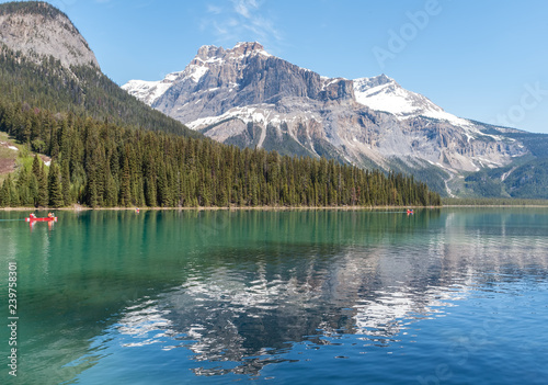 Canoe on Emerald Lake with Canadian Rocky Mountains reflection - Yoho NP, BC, Canada