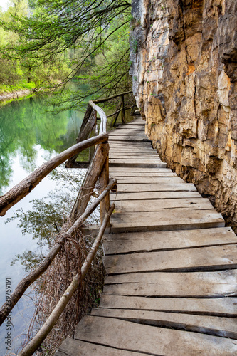 Elevated wooden walkway along Zlatna Panega River at Iskar-Panega Eco-path Geopark, the first geopark in Bulgaria photo