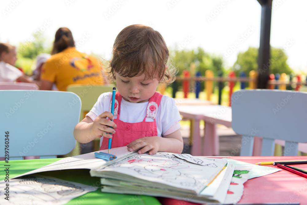little girl drawing a colorful pictures little girl drawing a colorful pictures