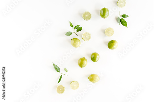 Pattern made of lime and leaves ficus. Food concept.  flat lay, top view