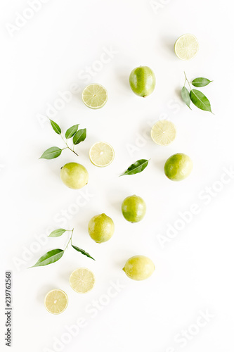 Pattern made of lime and leaves ficus. Food concept.  flat lay, top view