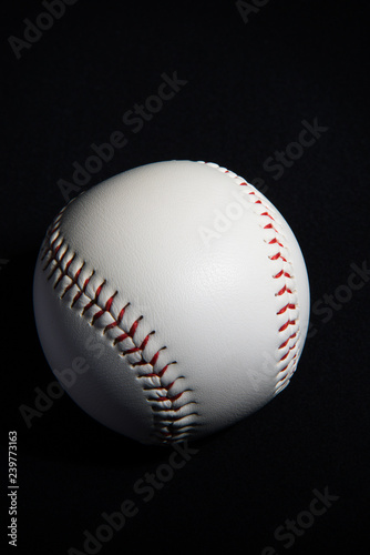 A baseball in the black background.