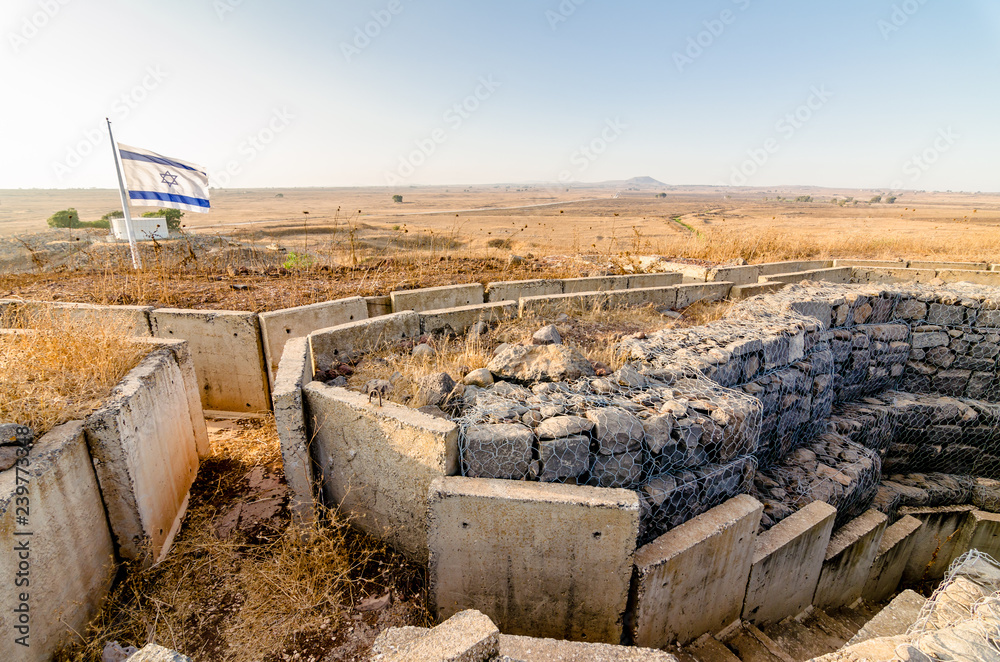 Israeli flag flying over fortifications from the Yom Kippur War at Tel Saki in Israel's Golan Heights