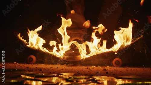 Breaking a flaming skateboard