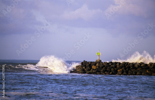 waves breaking on harbor entrance