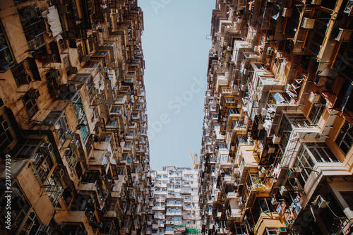 Famous building name Yick Fat Yick residentrial building at Cheong Fok Cheong in Quarry Bay, Hong Kong with urban housing apartment background. photo