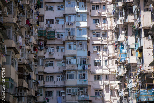 Famous building name Yick Fat Yick residentrial building at Cheong Fok Cheong in Quarry Bay, Hong Kong with urban housing apartment background. photo