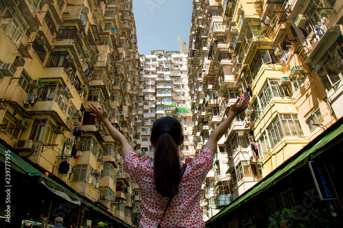 Famous building name Yick Fat Yick residentrial building at Cheong Fok Cheong in Quarry Bay, Hong Kong with urban housing apartment background. photo
