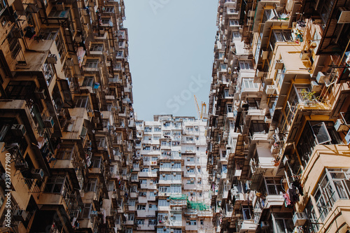 Famous building name Yick Fat Yick residentrial building at Cheong Fok Cheong in Quarry Bay, Hong Kong with urban housing apartment background. photo