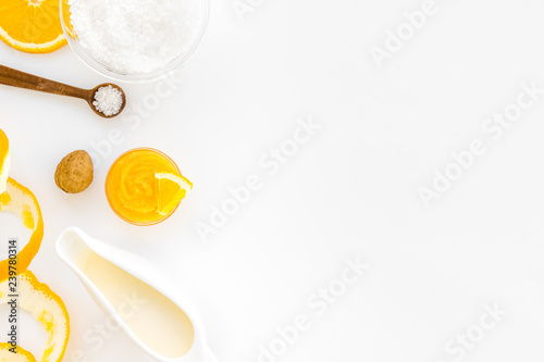 organic cosmetics for homemade spa with orange oil white background top view mockup