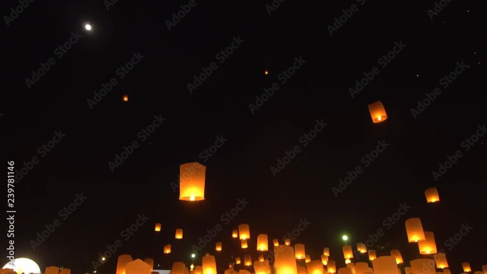 Yi Peng Lanna lanterns floating to night sky during festival in Chiang Mai, Thailand.