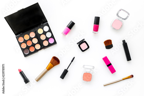 Professional cosmetics set with palette of eyeshadows on white background top view
