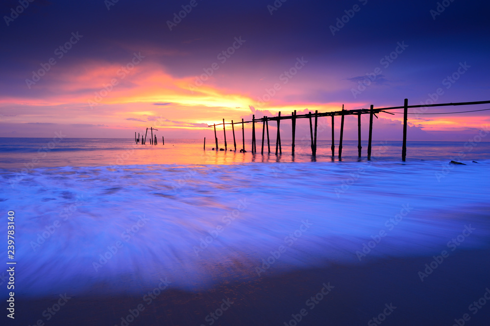 Seascape of Jetty wooden in Pilai beach, Phang-Nga, Thailand. Beautiful of seascape at sunset in sea southern of Thailand, 