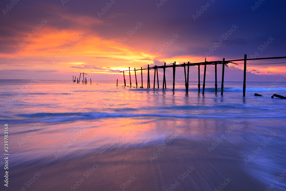 Seascape of Jetty wooden in Pilai beach, Phang-Nga, Thailand. Beautiful of seascape at sunset in sea southern of Thailand, 