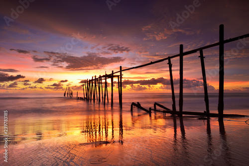 Seascape of Jetty wooden in Pilai beach  Phang-Nga  Thailand. Beautiful of seascape at sunset in sea southern of Thailand  