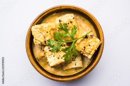 Malai or achari Paneer in a gravy made using Whipping Cream. served on a serving pan. selective focus