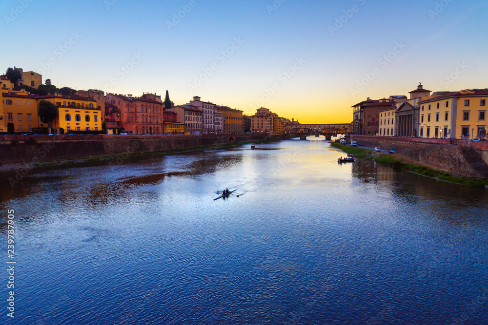Ponte Vecchio Bridge over river Arno at sunset. Florence. Italy