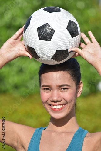 Girl Smiling With Soccer Ball