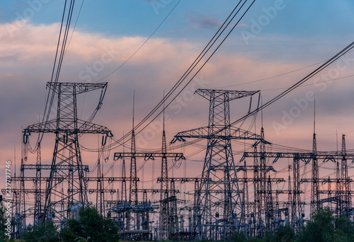 High-voltage power lines. Electricity distribution station. high voltage electric transmission tower. Distribution electric substation with power lines and transformers