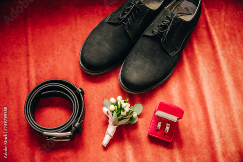 shoes, leather belt, boutonniere, wedding rings