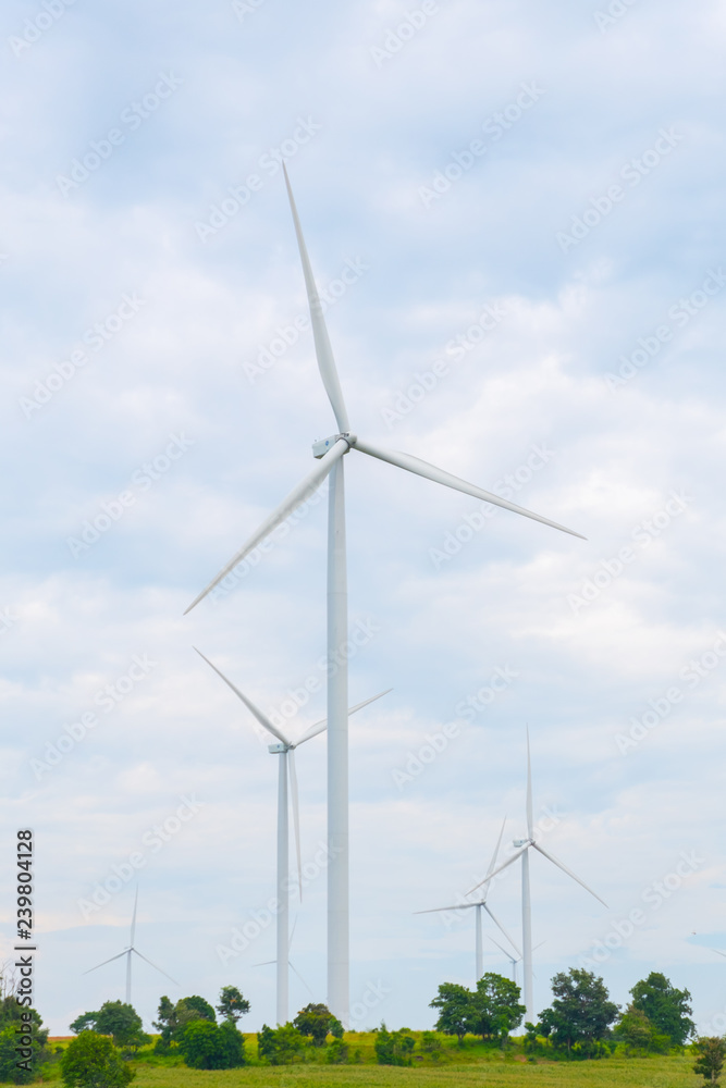 Wind turbine made Renewable Energy on field, blue sky and cloud background at Chaiyaphum Thailand with copy space