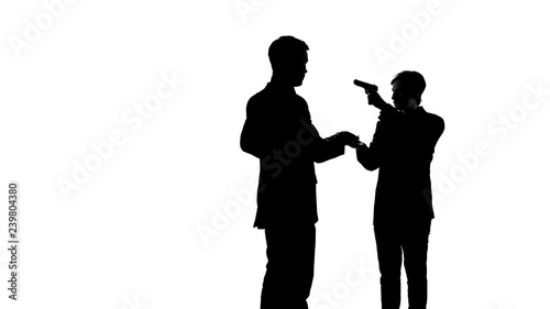 Scared man giving money to criminal threatening with gun, attack on business