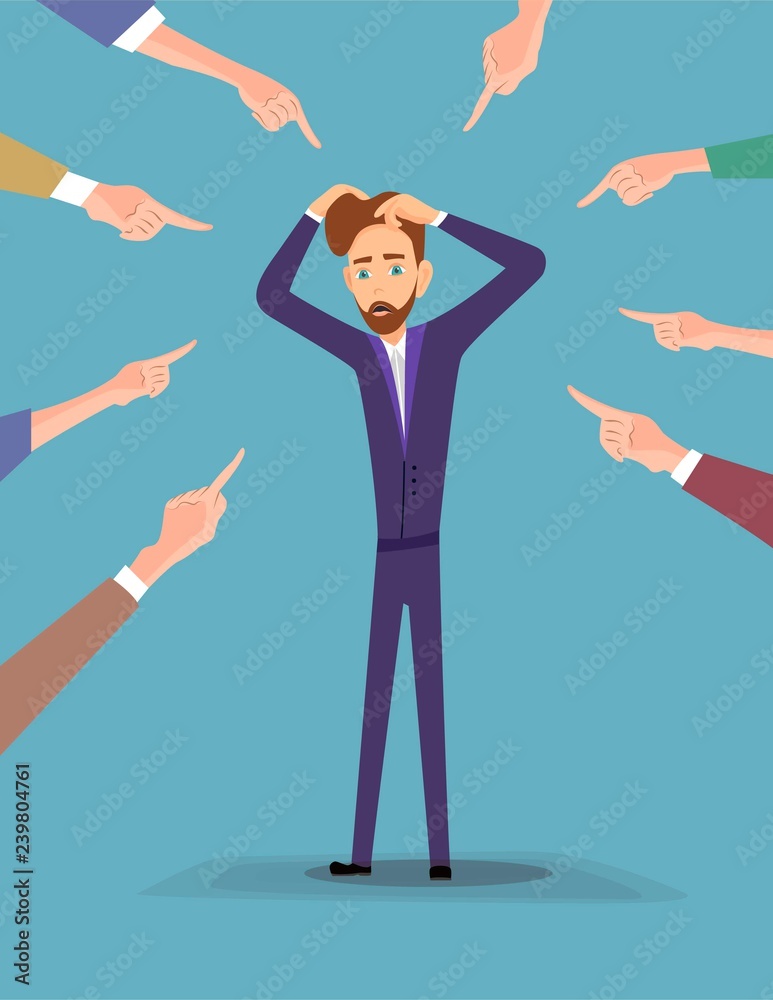 Depressed young man surrounded by hands with index fingers pointing at ...