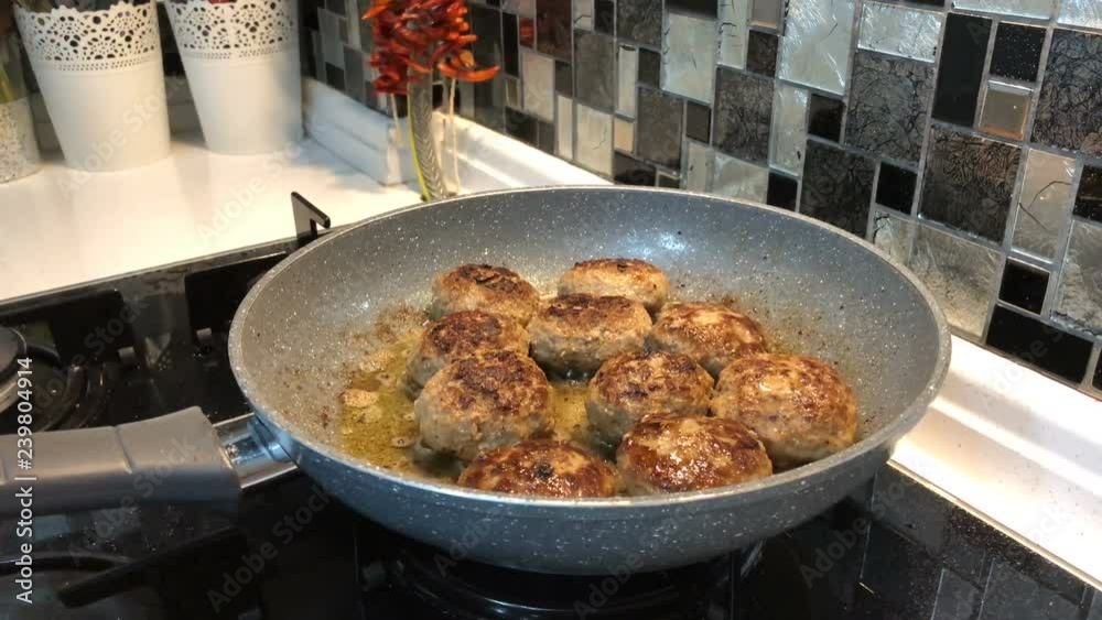 meat in a frying pan meat in a frying pan