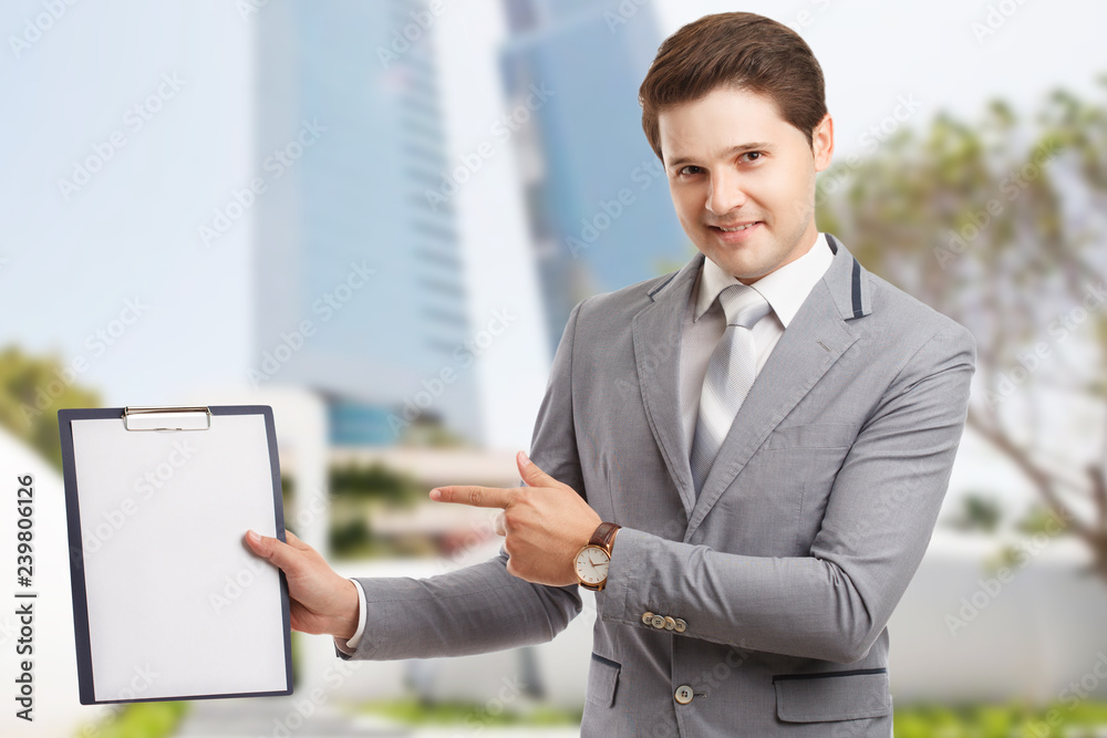 Business, technology, internet and networking concept. Young successful entrepreneur in the work process Business, technology, internet and networking concept. Young successful entrepreneur in the work process