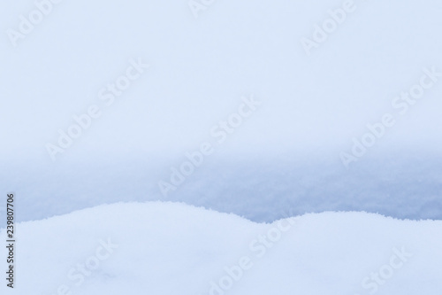 Full frame background of snow on the ground with little gap and shadow in the winter. Very simple and minimal abstract background.