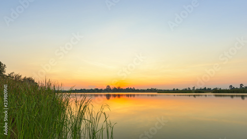 Landscape of calm lake at sunset