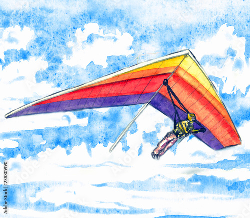 Canvas-taulu Hang glider on a bright colorful aircraft, sky with clouds landscape in soft col