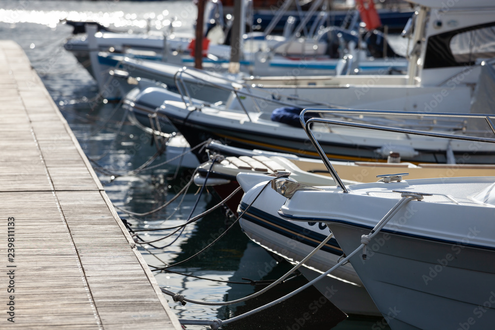 Fototapeta premium Modern yachts moored close up outdoor view