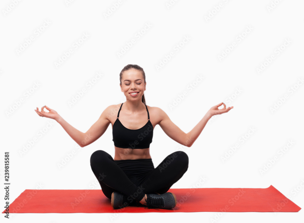 Caucasian young beautiful woman practicing yoga in studio over white background Caucasian young beautiful woman practicing yoga in studio over white background
