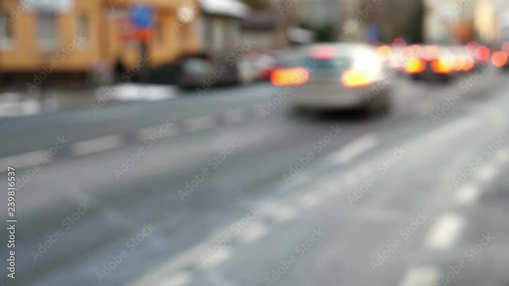 Blurred cars in busy traffic rush hour in the city street - static camera, automobiles moving away Blurred cars in busy traffic rush hour in the city street - static camera, automobiles moving away