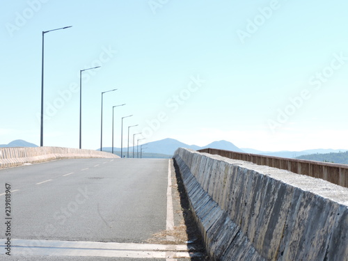 Symbolic empty Bridge and the road for traveler