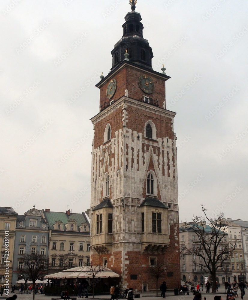 Below view of the high Catholic chapel in the center of the city against the background of the cloudy winter sky.