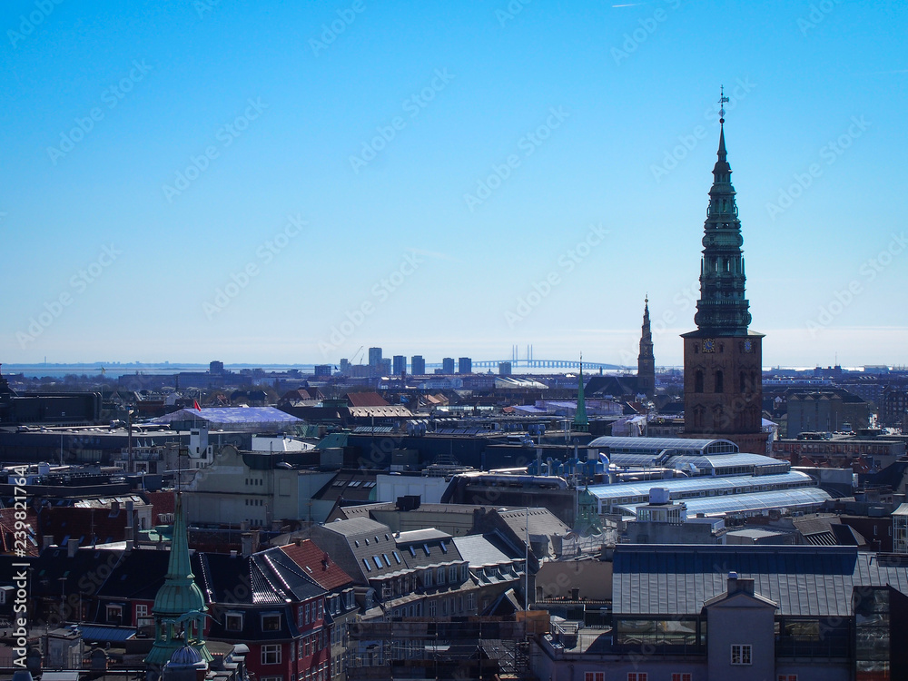 Copenhagen aeial view with the spire St. Nikolaj church and Oresund Bridge on the horizon