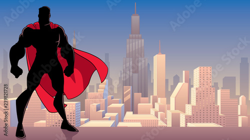 Silhouette of superhero standing tall on city background with copy space.