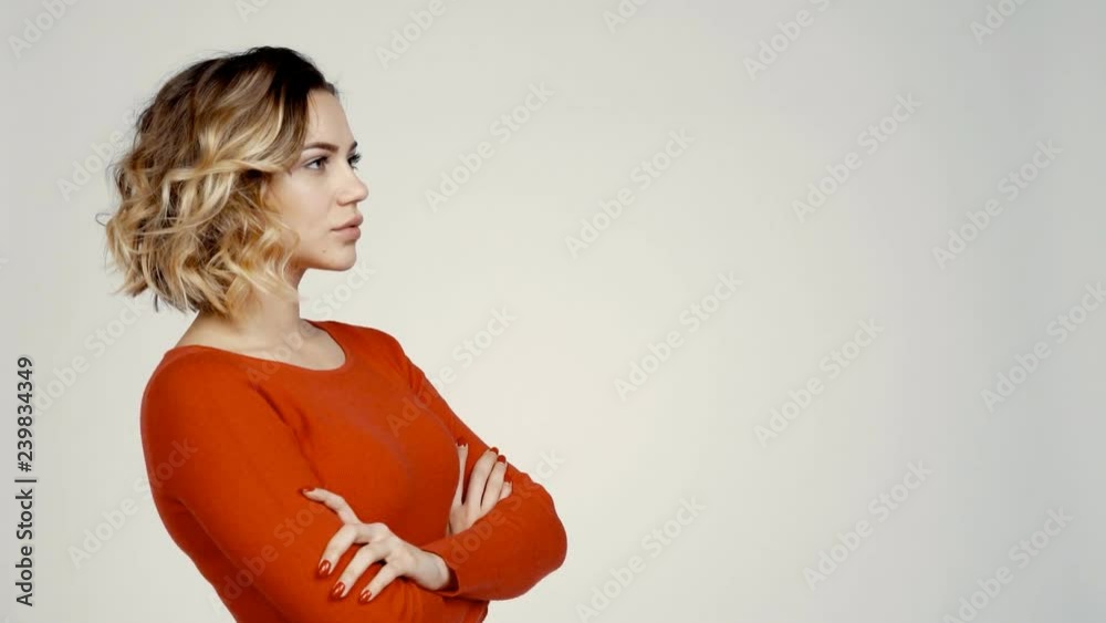 Side view portrait of confident beautiful young female looking forward at blank copy space smiling Side view portrait of confident beautiful young female looking forward at blank copy space smiling