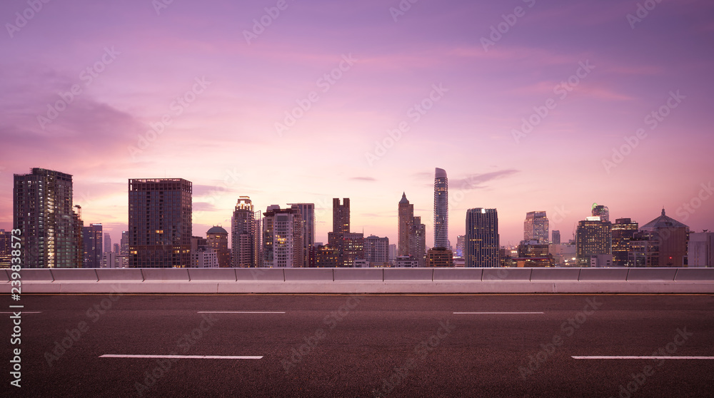 Asphalt road side with beautiful Bangkok city skyline. Night scene Asphalt road side with beautiful Bangkok city skyline. Night scene