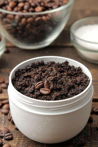homemade coffee scrub in a white jar for the face and body and various ingredients for making scrub. spa. cosmetics. care cosmetics