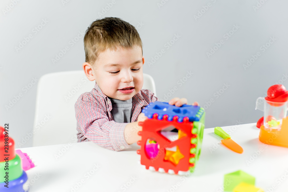 Dad and toddler son having fun playing at home Dad and toddler son having fun playing at home