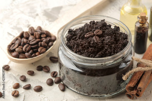 homemade coffee scrub in a jar for the face and body, and various ingredients for making scrub on a light background. spa. cosmetics. care cosmetics.
