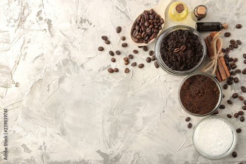 homemade coffee scrub in a jar for the face and body, and various ingredients for making scrub on a light background. spa. cosmetics. care cosmetics. top view with space for text