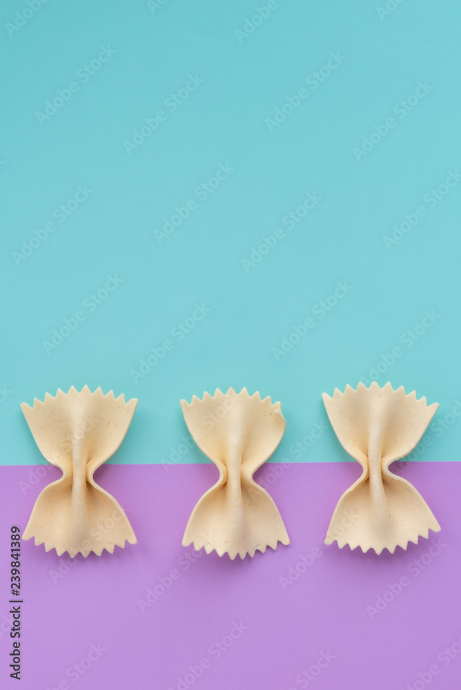 Pattern yellow pasta on a blue and pink background. Pattern yellow pasta on a blue and pink background.